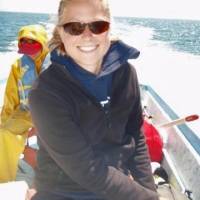 Angie Sremba riding in an boat